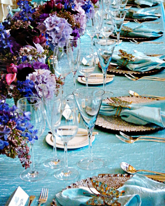 All 15 guests were seated at a long feast table dressed in turquoise linens