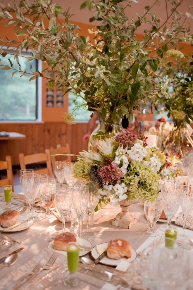 Tall Wedding Centerpieces with Branches Ivory Linens Weathered Iron Urns Crystal Stemware